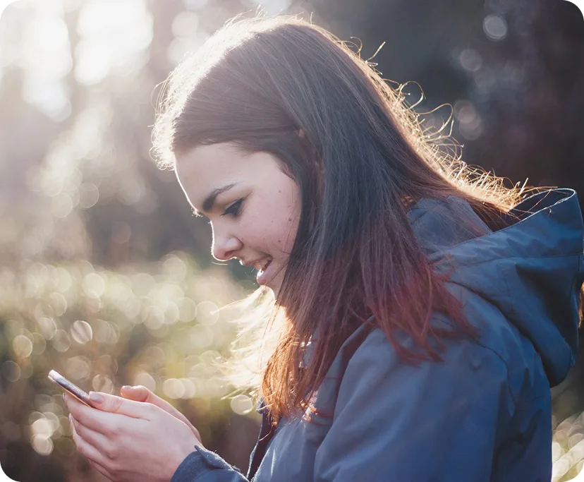 a woman looking at her phone